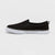 Black slip-on sneaker with white sole on a light gray background