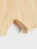 Close-up of a beige baby romper with a plain background