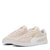 A pair of Puma Suede Classic sneakers in a light beige colorway with metallic gold branding and a white side stripe, shown against a plain white background.