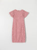 Pink lace dress on a light gray background