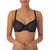 A woman wearing a black sheer mesh underwire bra against a plain white background.
