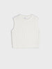 White sleeveless knitted top on a light gray background