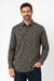 Man wearing a patterned shirt with a white background