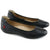 A pair of women's black leather ballet flats with a rounded toe and a small red brand tab on the heel, shown on a white background.