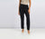 Person wearing black pants on a plain background