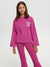 Child wearing a pink outfit with text on a white background