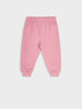 Pink sweatpants on a light gray background