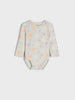 Baby bodysuit with floral pattern on a light gray background