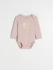 Pink baby bodysuit with floral design on a white background