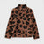 A brown fleece jacket with a black leopard print pattern, featuring a mock neck collar and a front zipper, shown against a light gray background.
