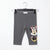 A pair of toddler's heather gray jogger leggings hanging on a black hanger against a white background, featuring a large graphic of Minnie Mouse on the lower left leg.
