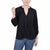 A woman wearing a black long-sleeve blouse with a split neckline and small silver rhinestone embellishments on the chest, paired with blue jeans, against a plain white background.