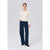 A woman modeling a cream long-sleeve knit top and dark blue wide-leg jeans against a light gray studio background.