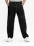 Person wearing black cargo pants on a white background