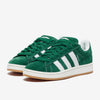 Green Adidas sneakers with white stripes on a white background