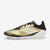 Gold and black soccer cleat with white sole on a light gray background