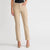 A model wearing beige straight-leg jeans with a black top and beige high heels, shown from the waist down against a light gray studio background.