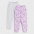 Two pairs of children's jogger sweatpants laid flat on a light gray background. The front pair is light lavender with an all-over cartoon dog face print, and the back pair is light heather gray.