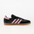 Black sneaker with pink stripes on a white background