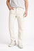 Person wearing white jeans and a light gray shirt on a white background