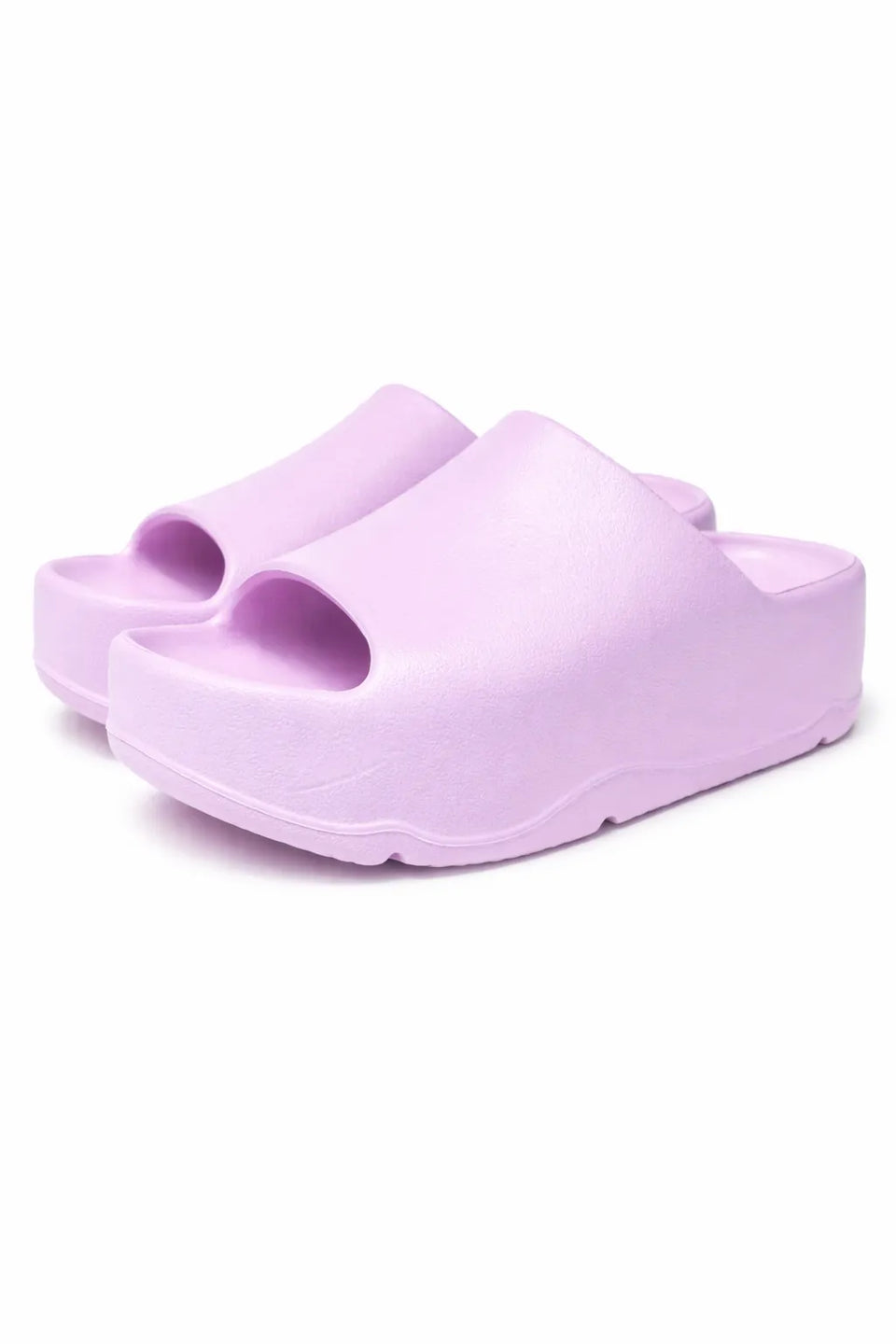 Pair of purple sandals on a white background