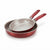 Two nested frying pans with metallic silver interiors and textured red exteriors, featuring red handles, shown on a clean white background.