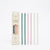 A set of six pastel-colored tumblers straws displayed next to their cream-colored packaging box on a clean white background. The straws come in shades of teal green, dark green, light pink, soft pink, pale yellow, and off-white.