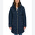 A woman wearing a dark navy blue hooded puffer coat with gold-toned zippers and drawstrings, shown against a plain white studio background.
