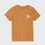 A short-sleeve crewneck t-shirt in a warm, muted orange-brown color, featuring a small white line-art graphic of a wave and figure on the left chest, displayed against a light gray background.