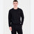 Man wearing a black long-sleeve shirt and pants on a white background