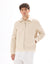 Man wearing a beige jacket on a white background