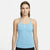 A woman modeling a light blue Nike athletic tank top with a small white swoosh logo on the chest, set against a plain light gray studio background.