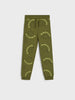 Green dinosaur-themed sweatpants on a white background