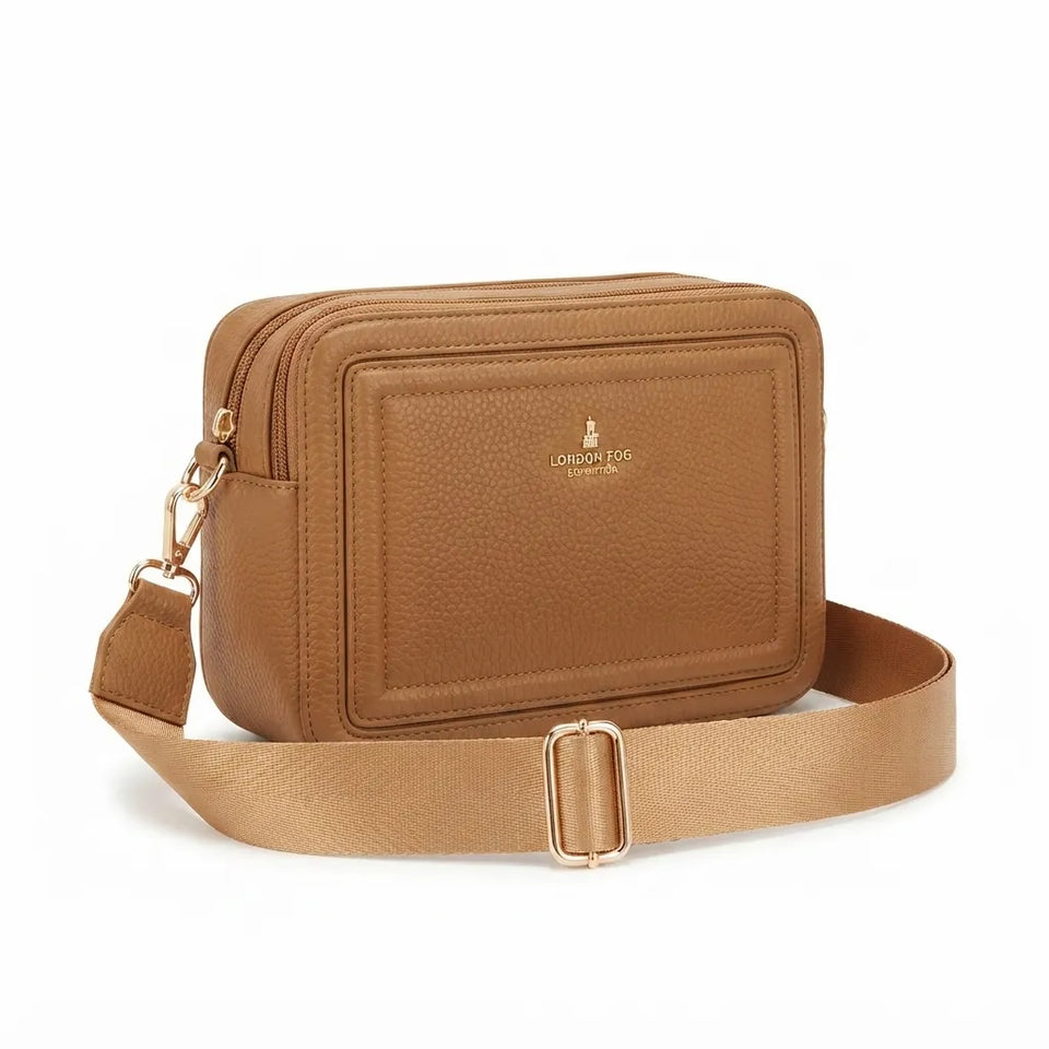 A tan pebbled leather crossbody bag with a matching adjustable shoulder strap and gold-tone hardware, featuring a gold-embossed logo on the front pocket, set against a plain white background.