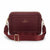 A burgundy pebbled leather crossbody camera bag with a matching adjustable webbing strap and gold-tone hardware, featuring the 'LONDON FOG collection' logo on the front, set against a plain white background.