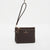 A dark brown textured leather wristlet clutch with a matching wrist strap, gold-tone hardware, and a gold-embossed logo on the front, set against a plain white background.