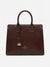 A dark brown leather tote bag with double top handles, a hanging leather tag, and gold-tone branding on the front, photographed against a clean white background.
