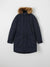Navy parka coat with fur hood on a light gray background