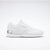 White sneaker with a brand logo on a light gray background