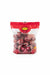 Bag of Saifan red onions with a hand holding it.