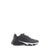 A black athletic sneaker with a chunky white and black sole, shown from a side profile view against a plain white background.