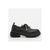 A single black leather oxford-style shoe with a chunky lug sole and silver-toned decorative laces, shown in profile against a light gray background.