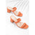 A pair of women's heeled mule sandals in a vibrant orange color, featuring a square toe, double front straps, and a chunky block heel, displayed on a clean white background with soft leaf shadows.