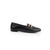 A black leather flat shoe with a gold-tone horsebit detail on the toe, shown in profile against a white background.