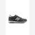 A dark gray New Balance sneaker with a metallic silver 'N' logo on the side, black laces, and a white midsole, shown in a side profile against a white background.