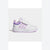 A white Adidas toddler sneaker with light purple accents, featuring a hook-and-loop strap closure and three purple stripes on the side, set against a light gray background.