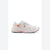 A white athletic sneaker with orange and light blue accents, featuring a mesh and synthetic upper, white laces, and a chunky white sole.
