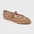 A single woven Mary Jane flat shoe in a brown and cream pattern with a gold buckle, shown on a light gray background.