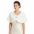 A woman wearing a white faux fur cape collar with a decorative crystal-embellished brooch, layered over a cream satin dress against a plain white background.