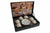 Set of 12 coffee cups and saucers in a decorative box on a desk.